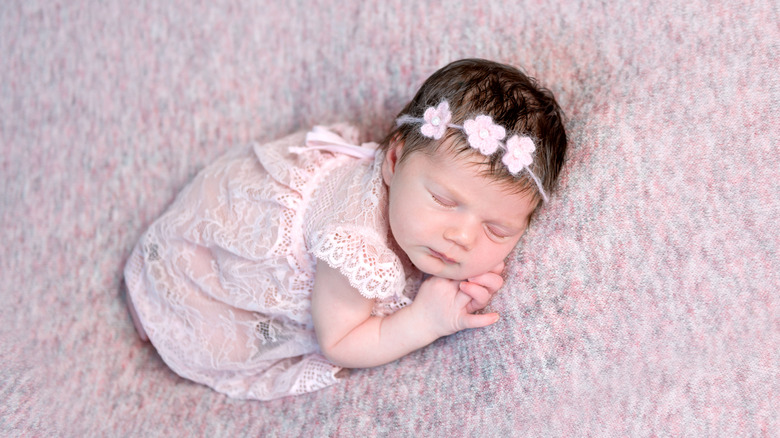 sleeping newborn baby girl photoshoot