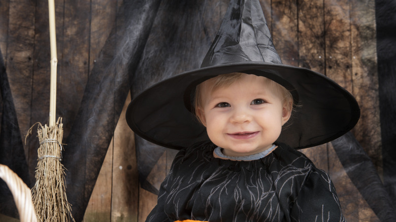 baby dressed up as a witch