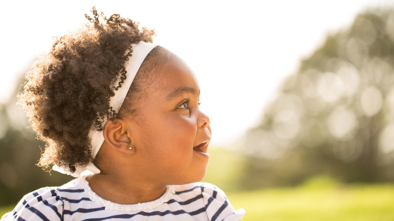 adorable little girl with curly hair