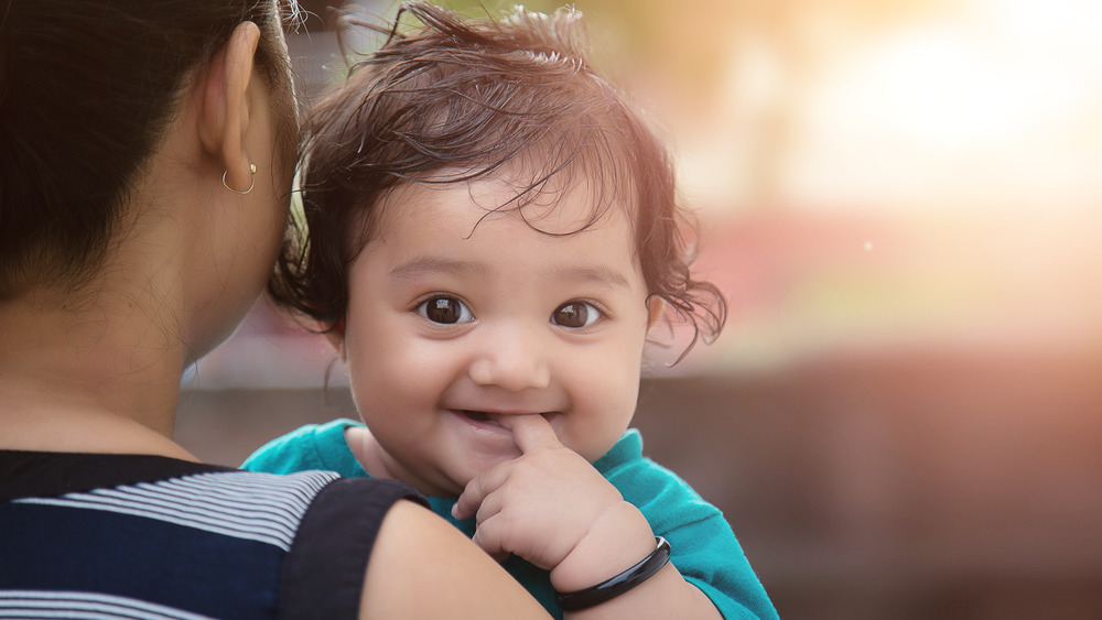 Smiling baby girl with mother