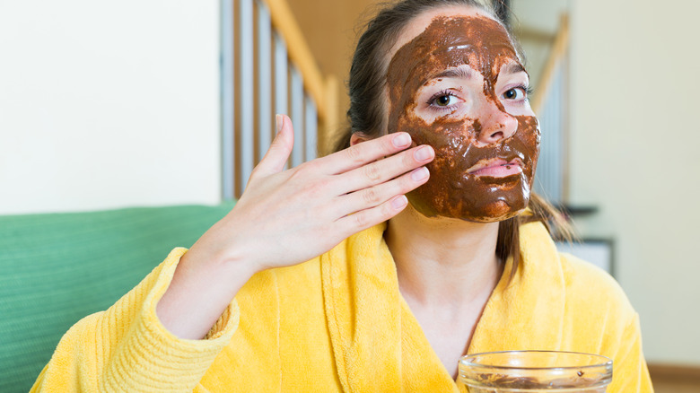 woman applying face mask