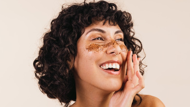 A woman using exfoliating scrub