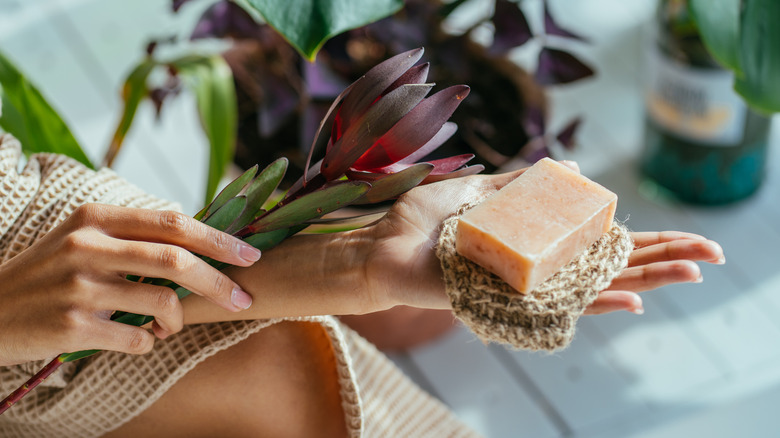 Woman holding a bar of soap