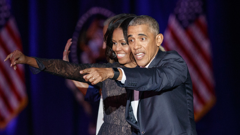 Barack and Michelle Obama celebrating