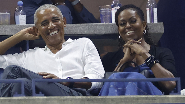 Former U.S. President Barack Obama and Former First Lady Michelle Obama sitting in the stands at 2023 US Open Tennis Tournament