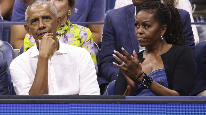 Barack and Michelle Obama watching a tennis match during the 2023 U.S. Open