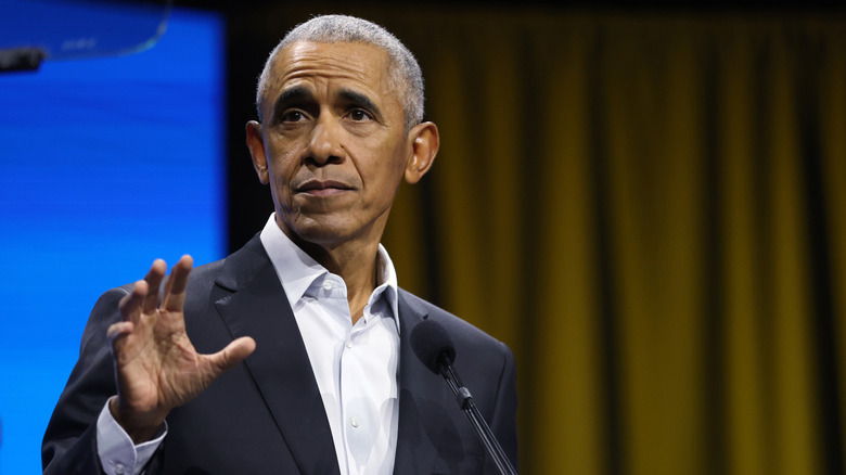 Barack Obama holds his hand out