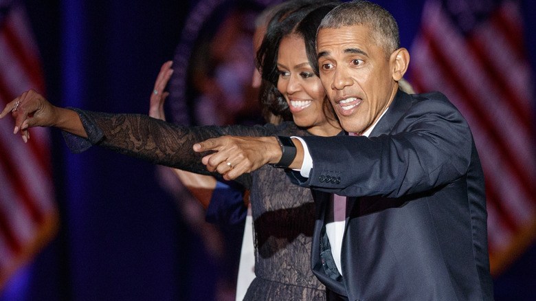 Barack and Michelle Obama standing closely 