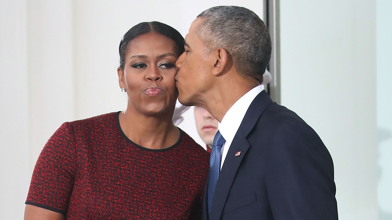 Barack kisses Michelle on the cheek