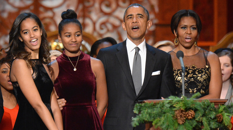 The Obama family standing at a podium together