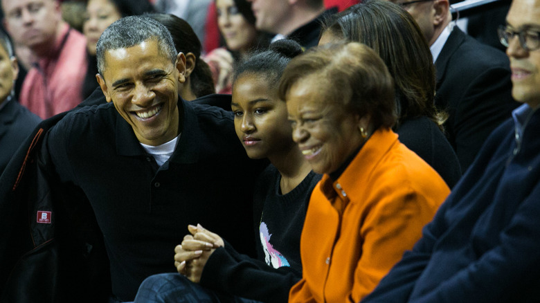 Barack and Sasha Obama at a basketball game