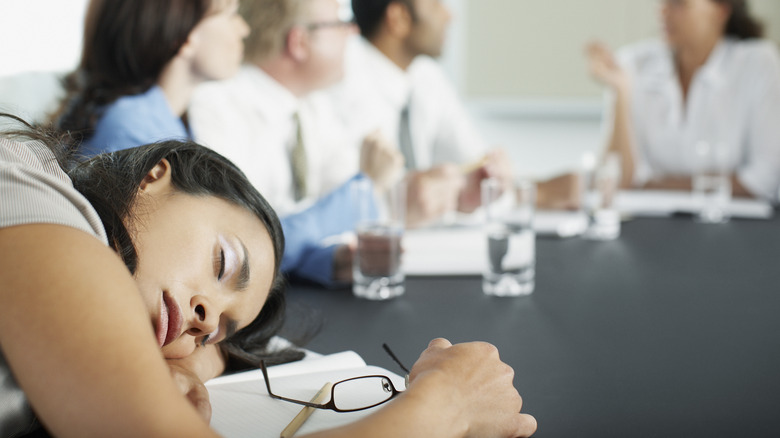 woman sleeping during a meeting