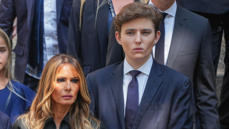 Barron and Melania Trump looking somber