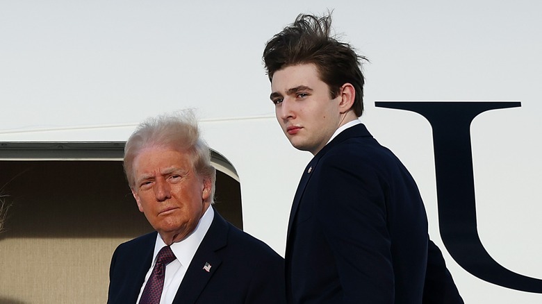 Donald Trump and Barron Trump boarding a plane