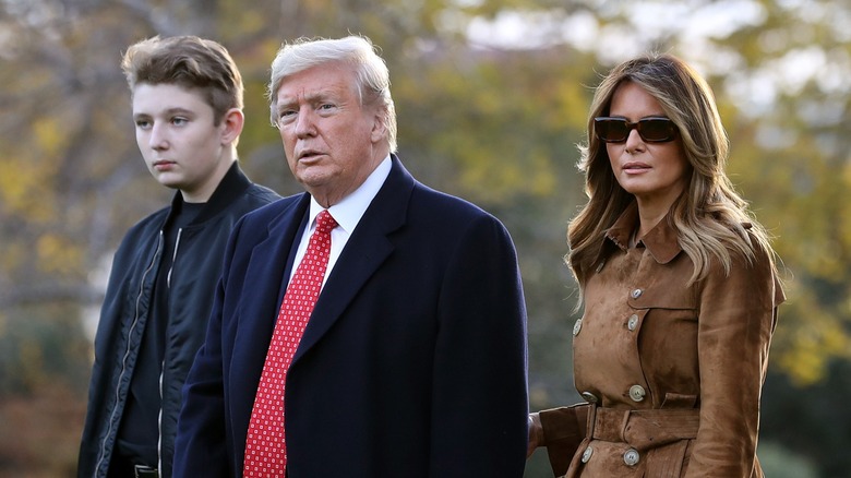 Barron Trump walking with his parents