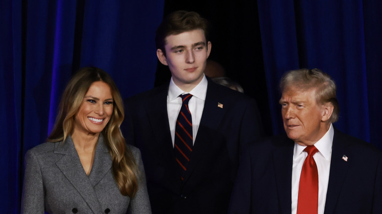 Melania, Barron, and Donald Trump smiling