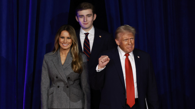 Melania, Barron, and Donald Trump posing