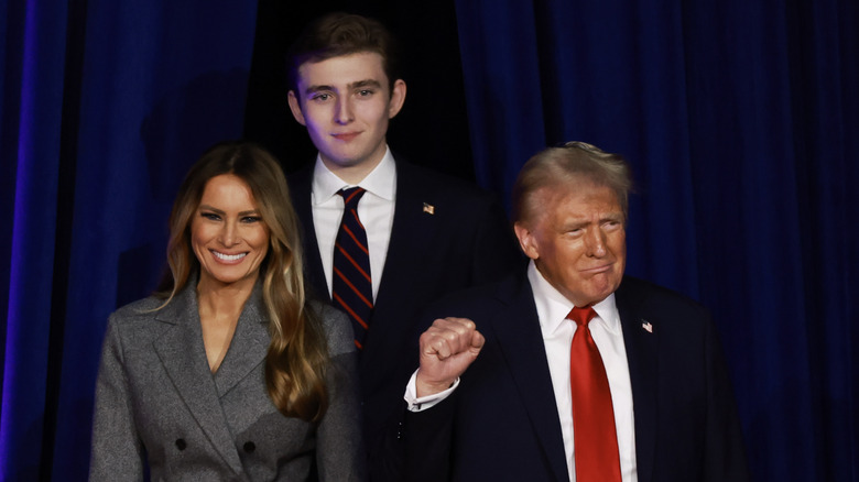 Barron Trump behind Melania and Donald Trump entering stage