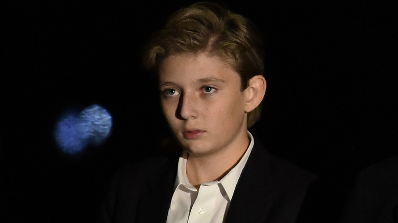 Barron Trump looking to the side