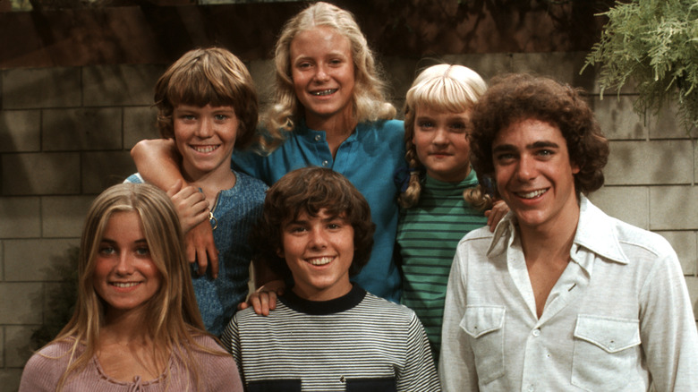 The kids from The Brady Bunch smiling