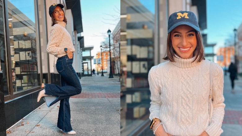 Woman wearing baseball cap and sweater 