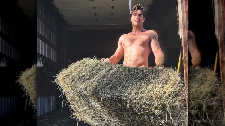 Pierson Fodé  lifting a bale of hay