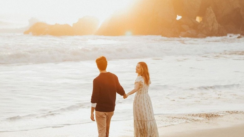 Annika Noelle and fiancé on the beach