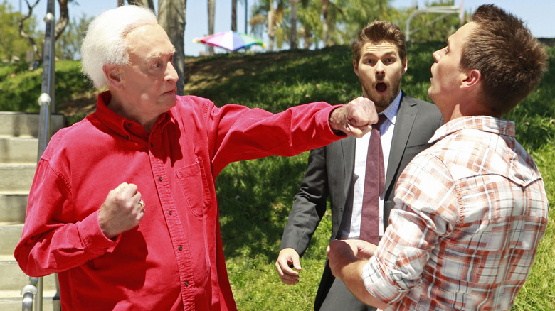 Bob Barker punching out Darin Brooks while a shocked Scott Clifton looks on