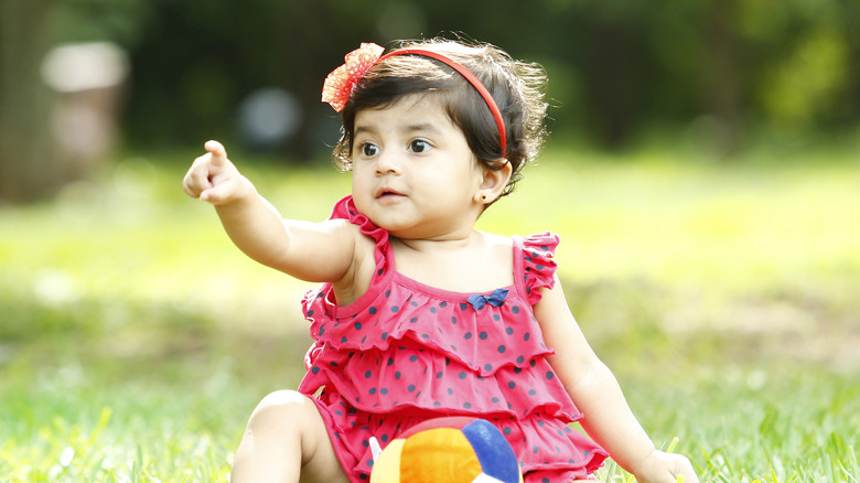 Baby girl in grass