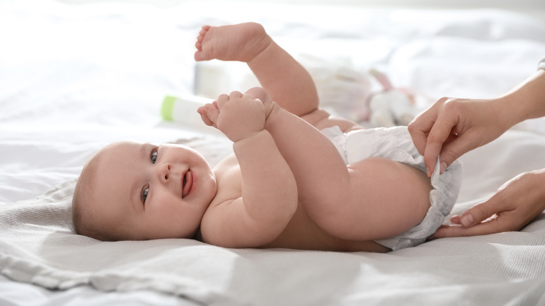 Baby smiling in a diaper