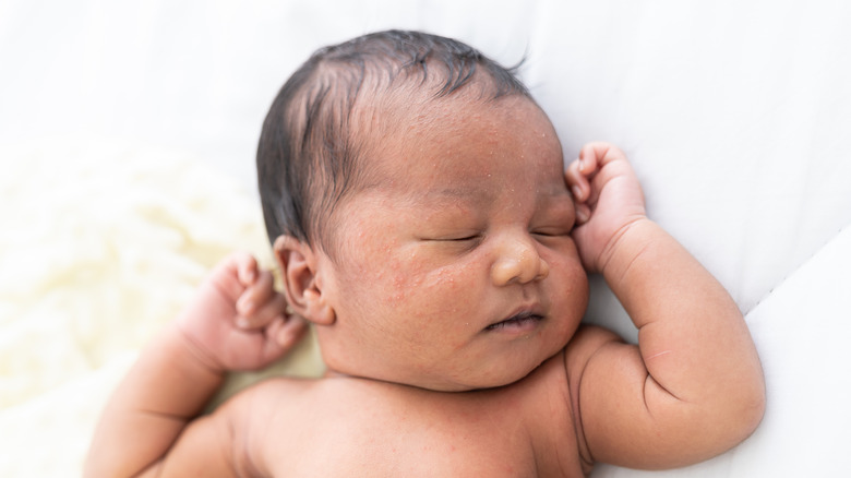 Baby sleeping in their crib