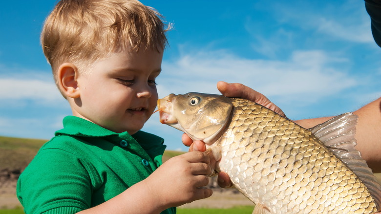Little boy with a fish