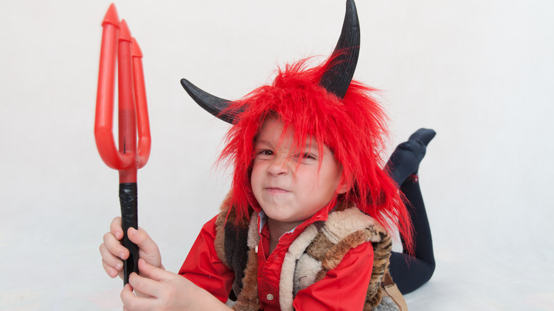Kid dressed up as devil