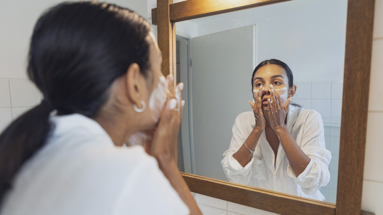 Woman washing her face