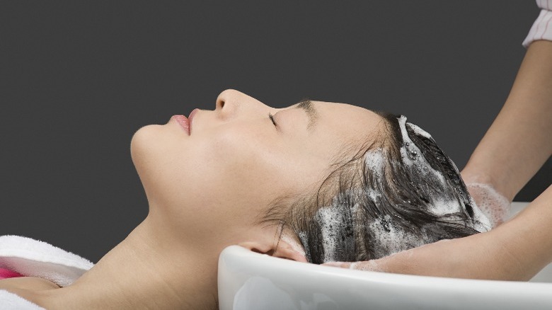 Woman getting her hair washed