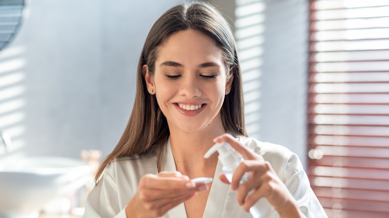 woman applying lotion