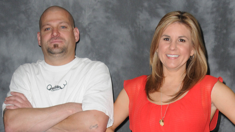 Jarrod Schulz crossing his arms next to smiling Brandi Passante