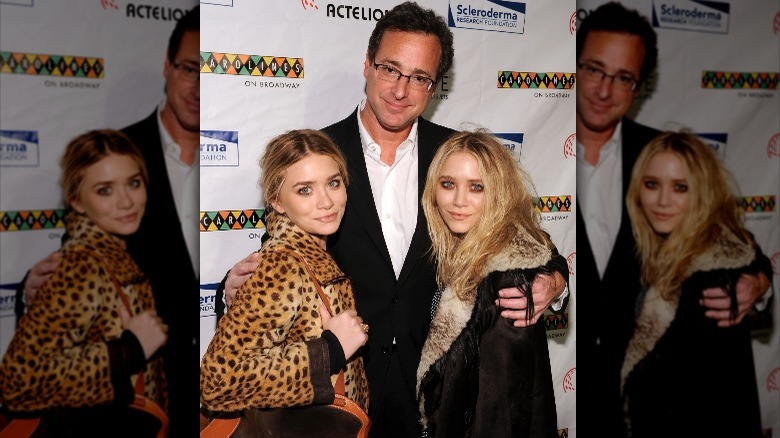 Bob Saget posing for a picture with Mary-Kate and Ashley Olsen