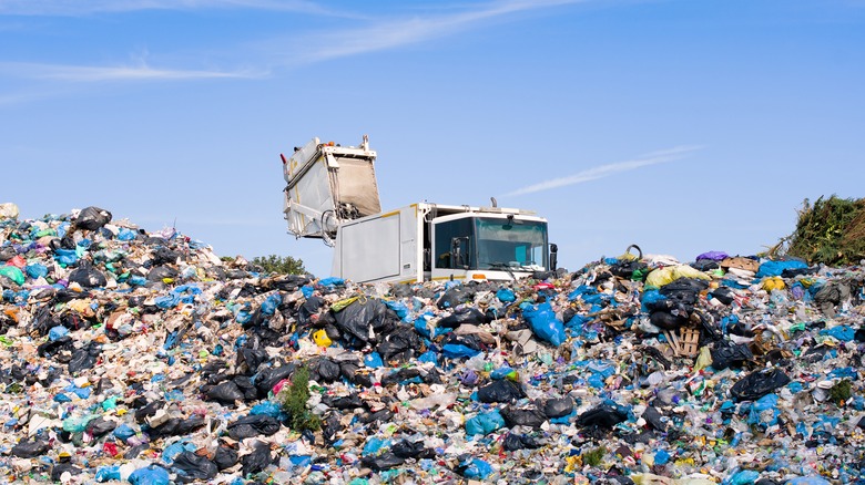 Garbage truck in landfill