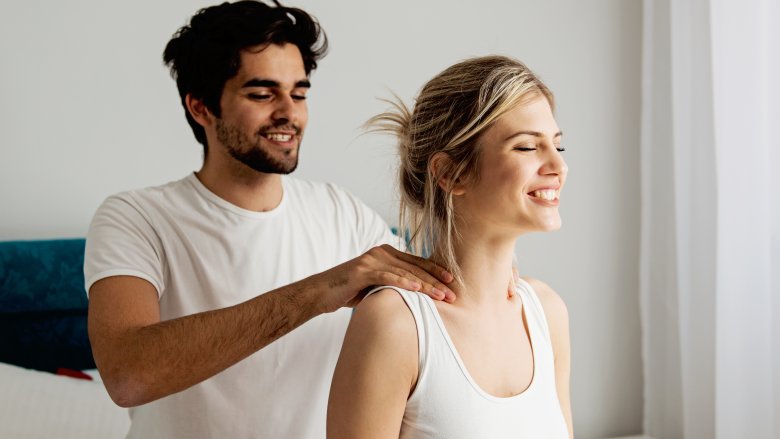 man giving woman a massage