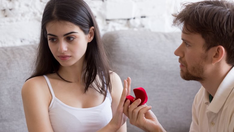 woman rejecting ring from man