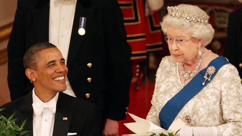 Barack Obama smiling at Queen Elizabeth II