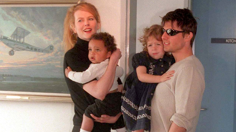 Nicole Kidman and Tom Cruise holding their children