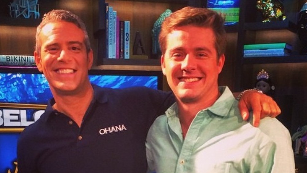 Below Deck's Eddie poses for a photo with Andy Cohen