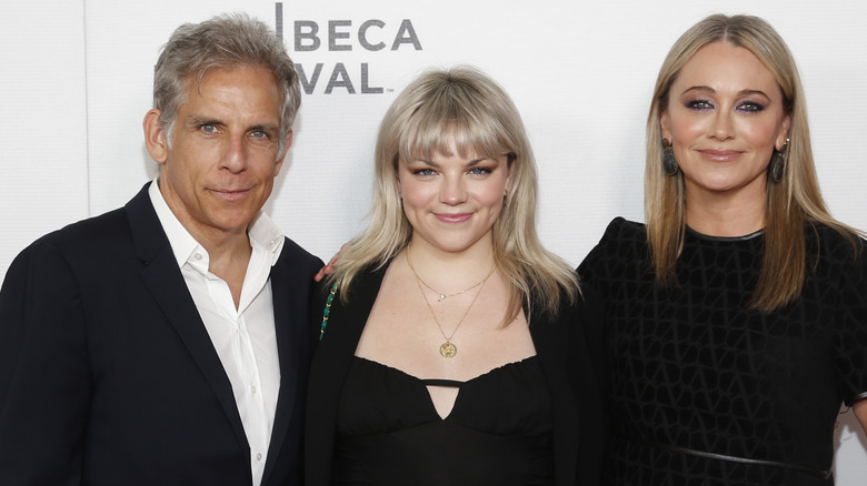 Ella Stiller smiling with parents 