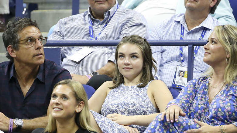 Ella Stiller sitting with parents