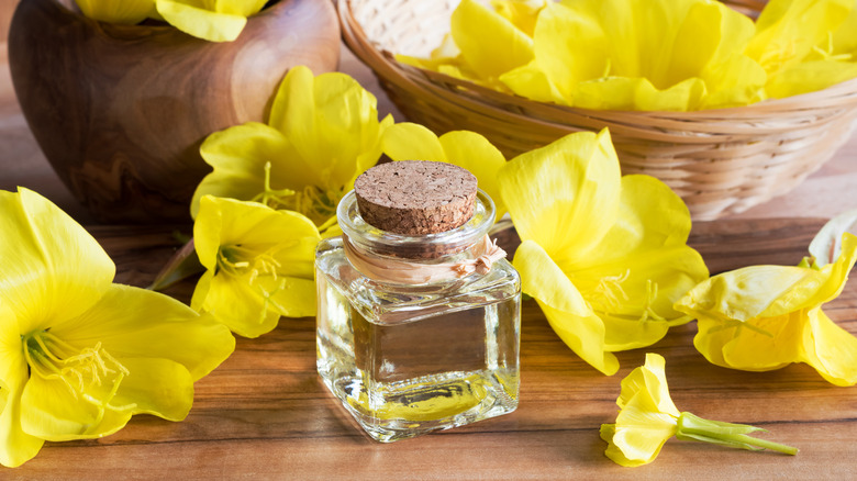 Primrose oil in jar on table 