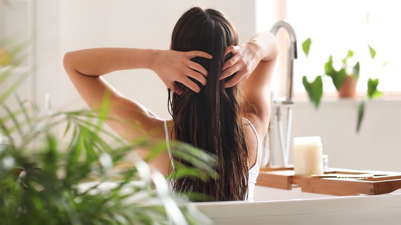 Woman applying oil