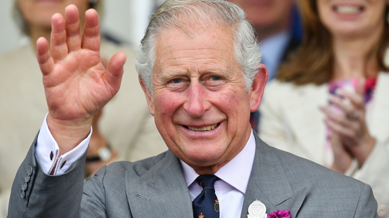 King Charles III waving