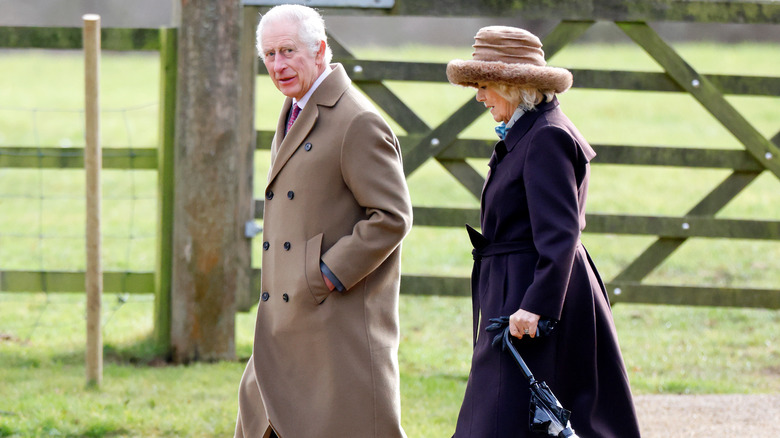 King Charles III walking with Queen Camilla